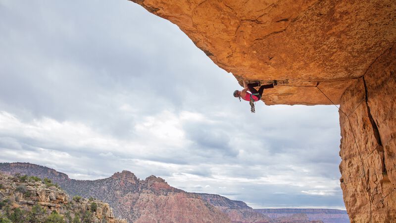  A climber hangs from an overhanging roof. 
