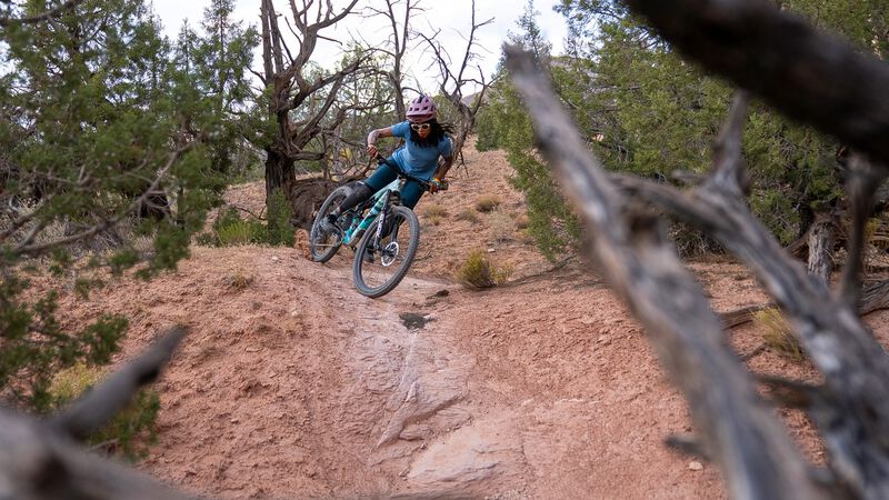  A mountain biker leans into a turn on the descent. 